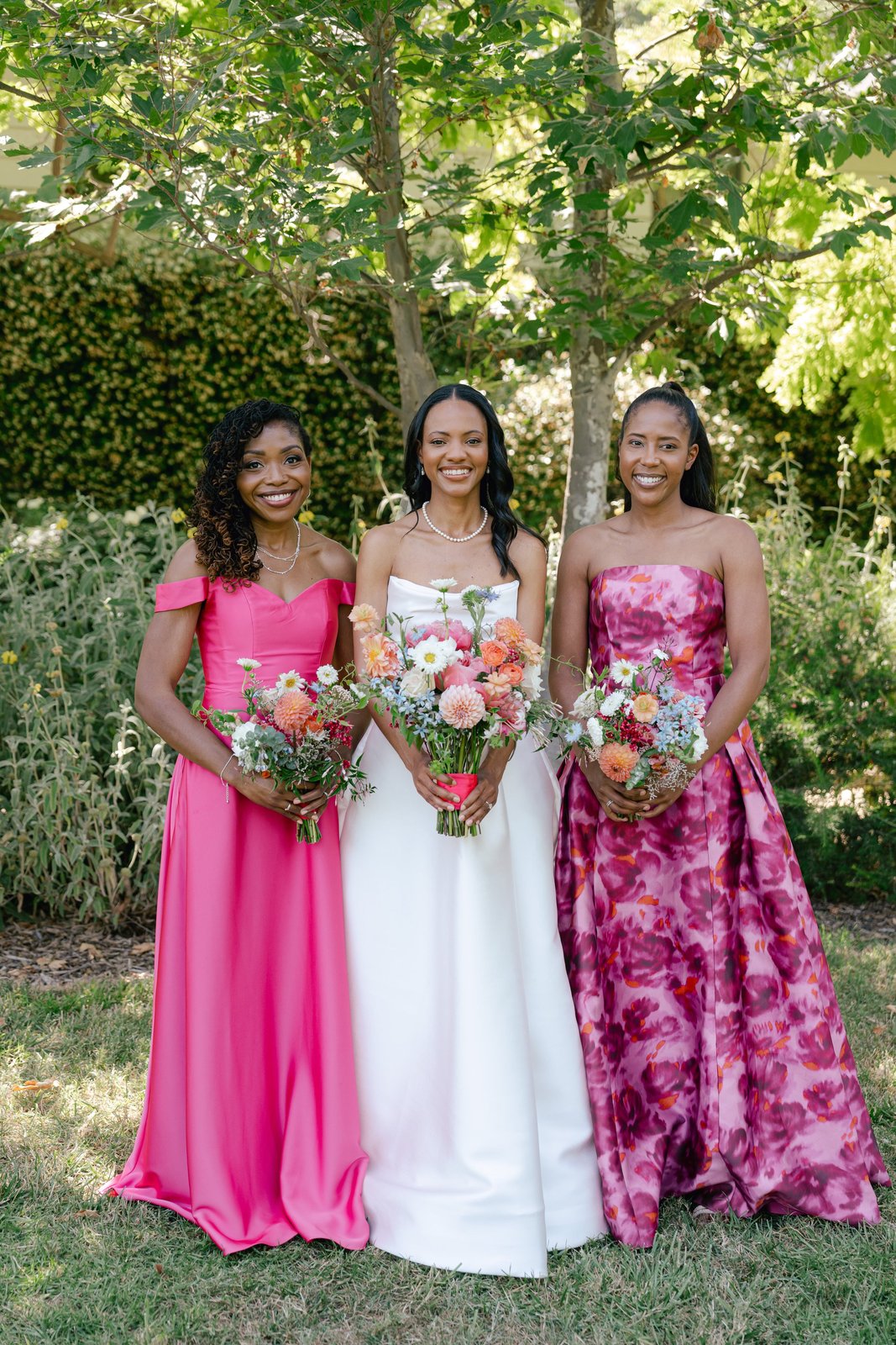 Bride and bridesmaids with bold colorful bouquets by Love Her Madly