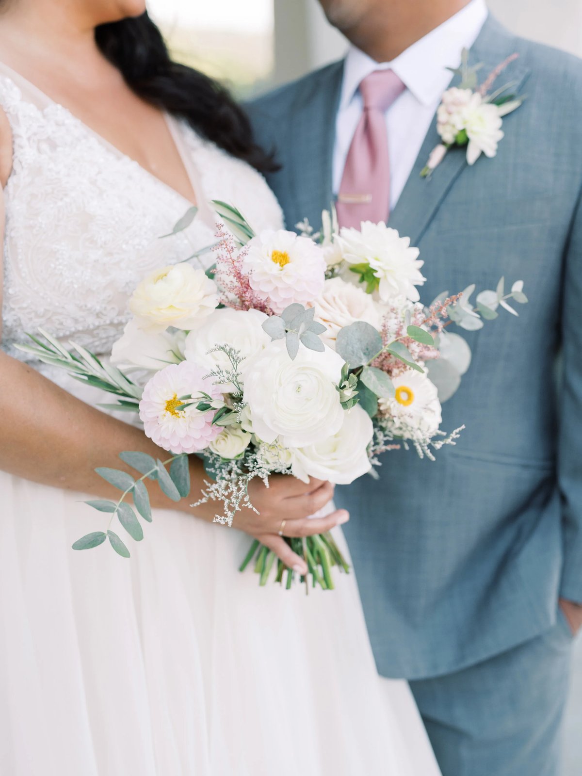 Coastal ceremony arch with lush florals