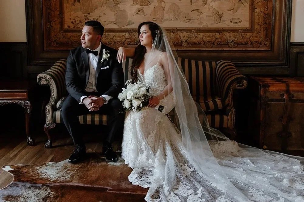 Couple with a cascading bouquet
